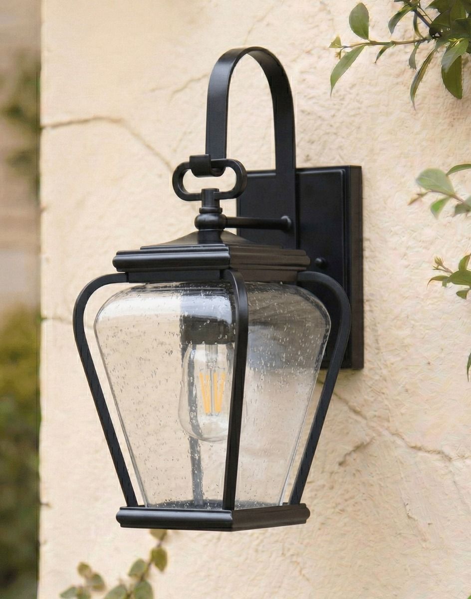 Digital Illustration of the Black "Kirkstead" Traditional Wall Lantern Mounted on a Rustic Cream Coloured Wall 