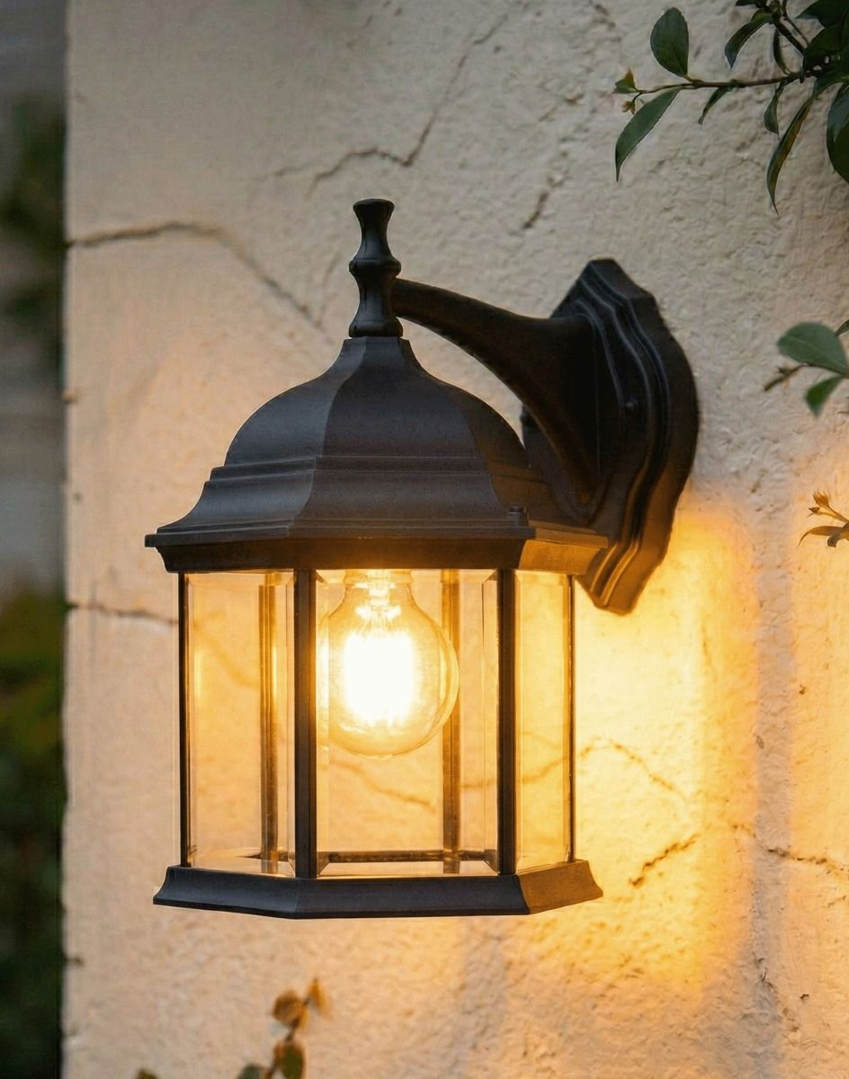 Digital illustration of the Black 36cm x 24cm Version of the Traditional Hexagonal Victorian Top-Fix Wall Lantern Lit up at Night