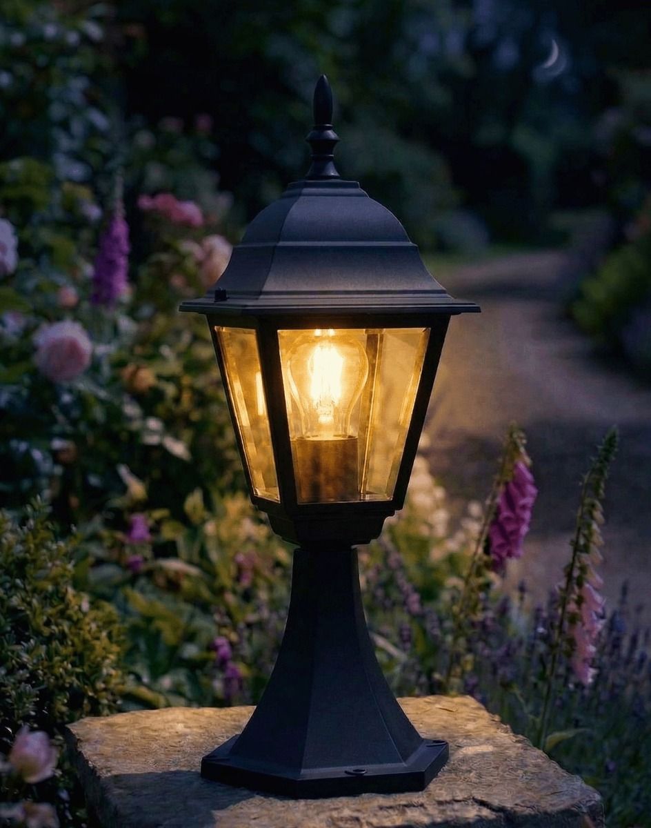 Digital Illustration of the Black "Chelsea" Traditional Pillar Light Mounted on a Stone Garden Pillar Surrounded by Flowers Lit up at Night