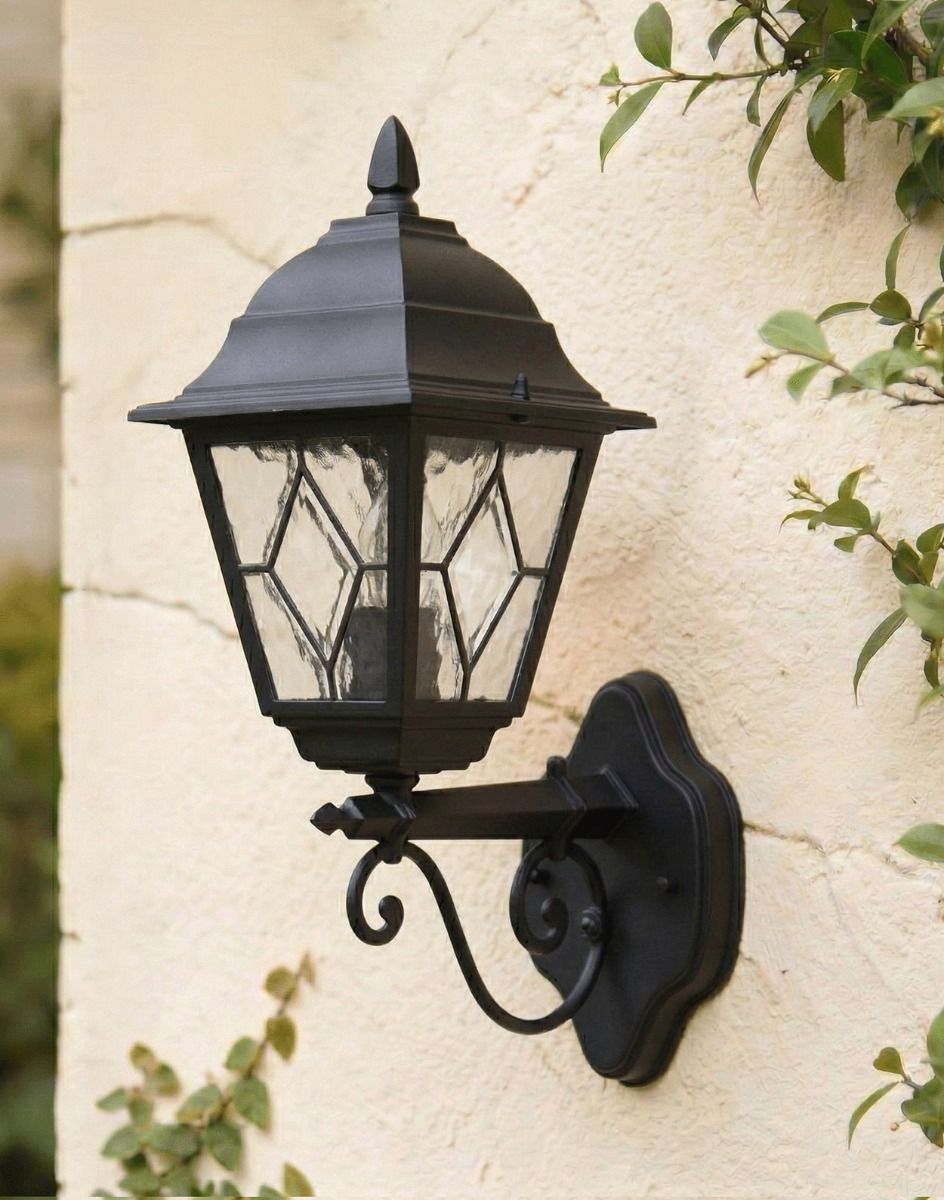 Digital Illustration of the Black Version of the Traditional Victorian Outdoor Wall Lantern with Ornate Bracket Attached and Mounted on a Cream Coloured Garden Wall