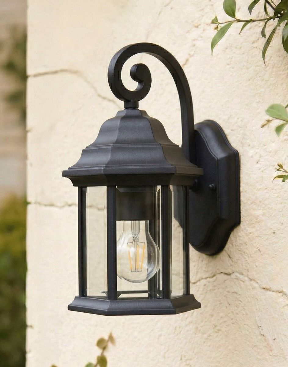 Digital Illustration of the Black Version of the Traditional Aluminium Ornate Top Fix Wall Lantern Mounted to a Cream Coloured Garden Wall