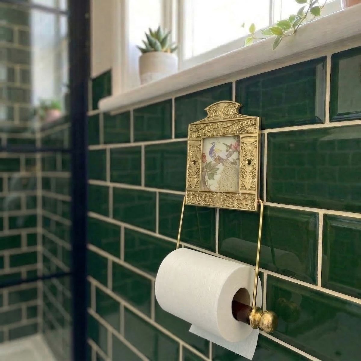 Digital Illustration of the Brass Version of the Globe Toilet Fixture Holding Toilet Roll from an Angled View