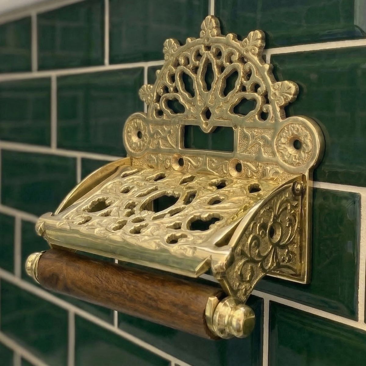 Digital Illustration of the Brass Version of the Sunrise Toilet Roll Holder Empty Mounted on Green Bathroom Tiles 