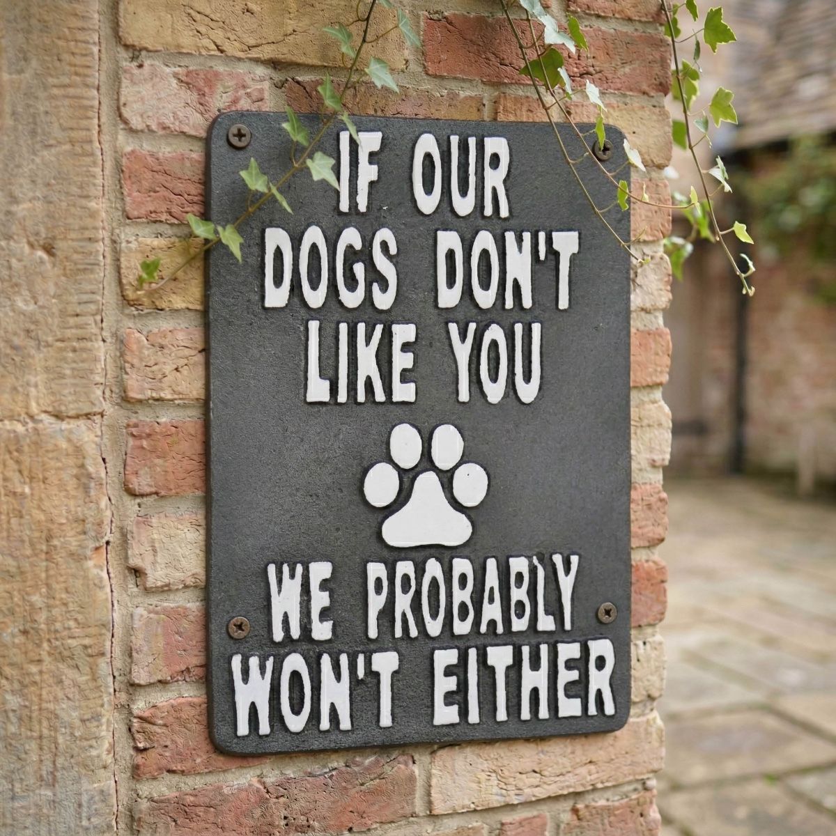 Digital Illustration of the Cast Iron "If Our Dods don"t Like You we Probably Won"t Either" Sign Mounted on a Red Brick Wall