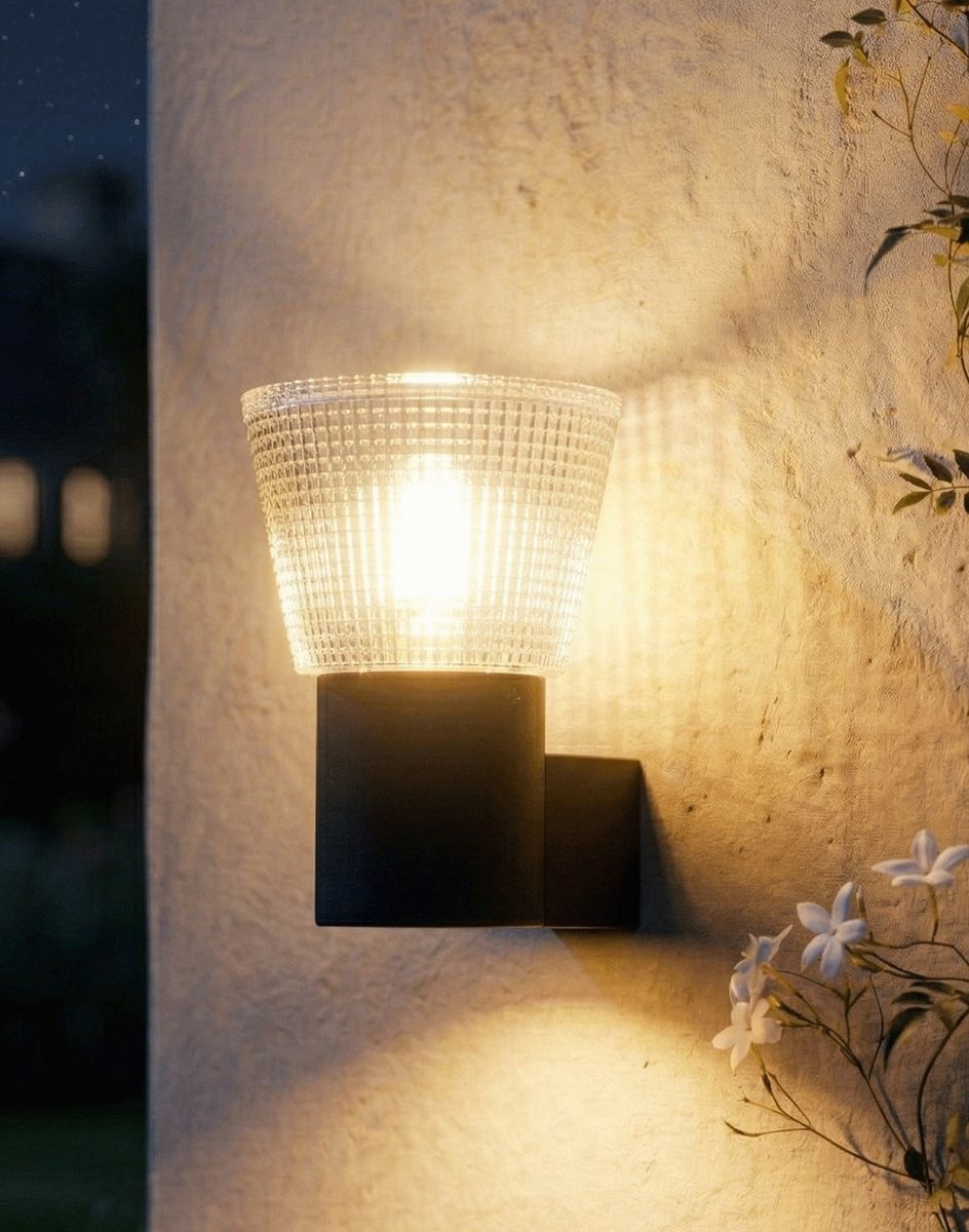 Digital Illustration of the Contemporary Black "Alton" Wall Light Lit up at Night