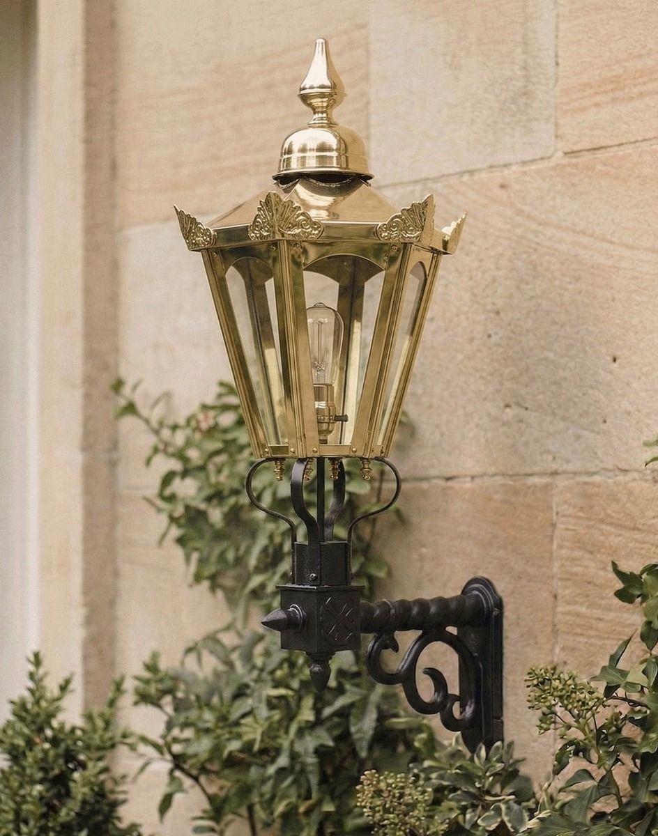 Digital Illustration of the Medium Concordia Hexagonal Brass Lantern With Royale Bracket Mounted on Sandstone Brick Building Entrance