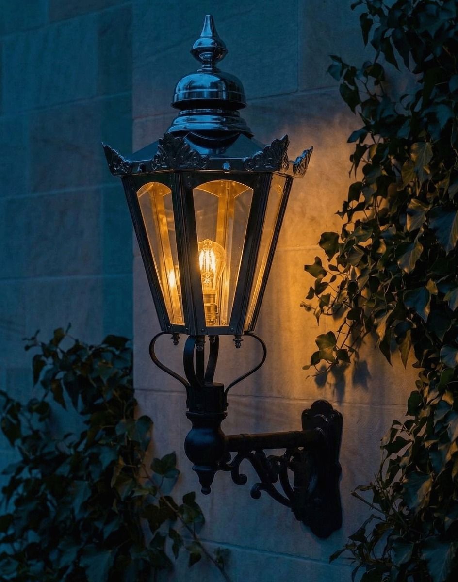 Digital Illustration of the Medium Concorida Hexagonal Polished Nickel Lantern On a Capella Bracket Lit up at Night