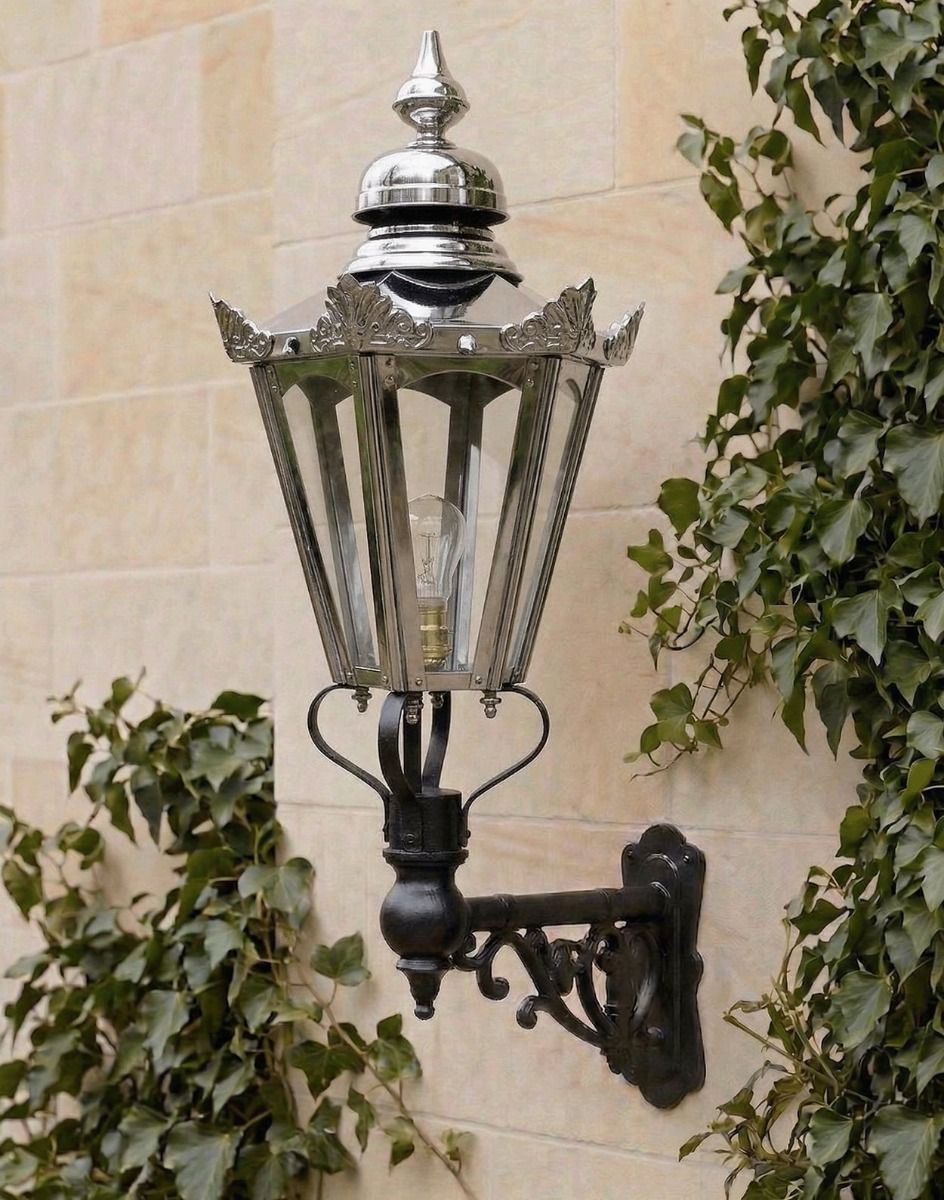 Digital Illustration of the Medium Concorida Hexagonal Polished Nickel Lantern On a Capella Bracket Mounted on a Traditional Sandstone Brick Wall