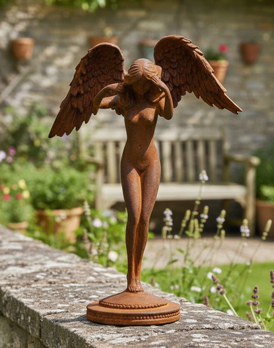 Digital Illustration of the Rustic Cast Iron Free Standing Winged Angel Sculpture on a Garden Wall with a Rustic Stone Garden Wall in the Background