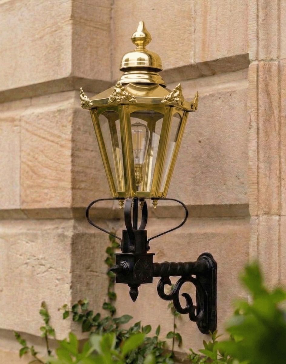 Digital Illustration of the Standard Brass Concordia Hexagonal Lantern With Royale Bracket Mounted on a Traditional Sandstone Brick Property Entranceway