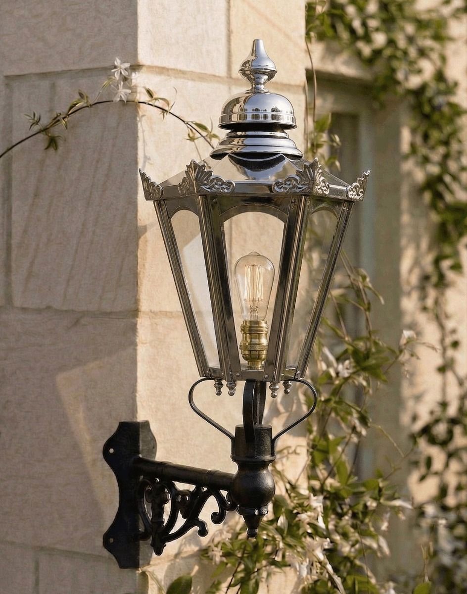 Digital Illustration of the Standard Concordia Hexagonal Polished Nickel Lantern Mounted on a Traditional Sandstone Brick Wall
