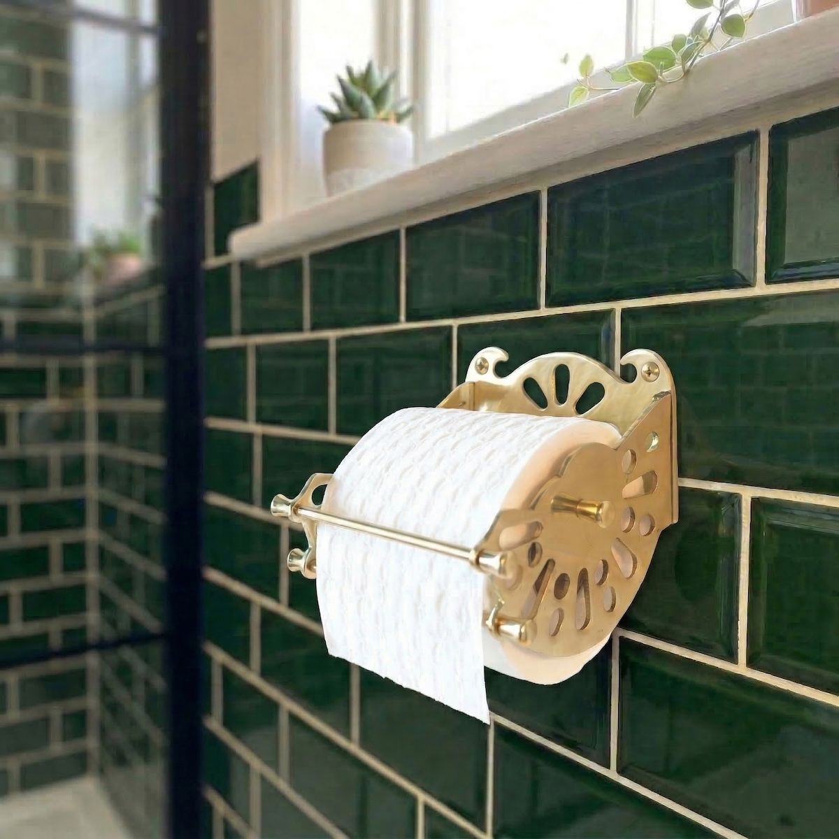 Digital Illustration of the Brass Version of The Victorian ”Mitchell” Toilet Roll Dispenser Holding Toilet Roll from an Angled View