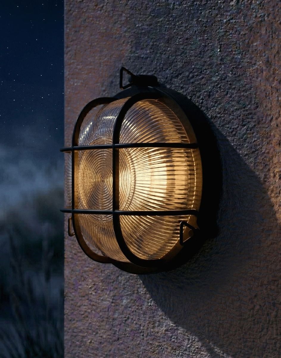 Digital Illustration of the Traditional Nautical Round "Danby" Bulkhead Wall Light in a Black Finish Lit up at Night