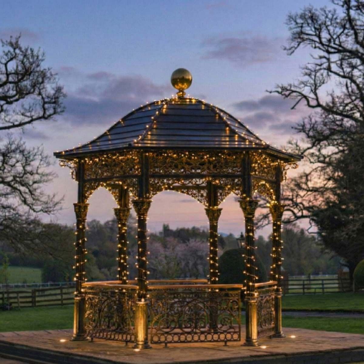 Digital representation of "The Versailles Temple" Ornate Solid Roof Garden Gazebo lit up at night