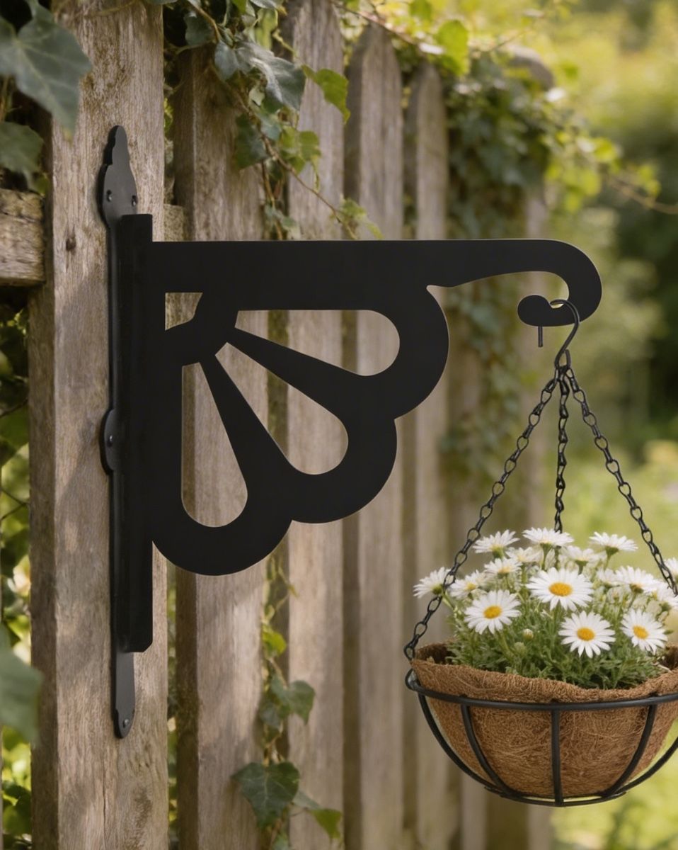 Digital representation of Clam Design Heavy Duty Iron Hanging Basket Bracket mounted on a fence