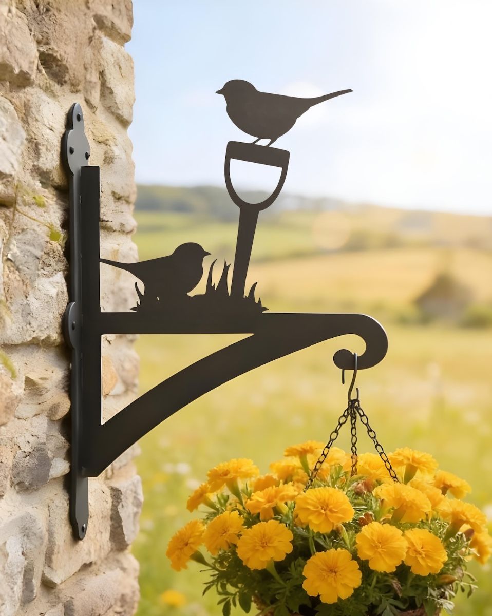 Digital representation of Robin Steel Hanging Basket Bracket mounted on a farm cottage