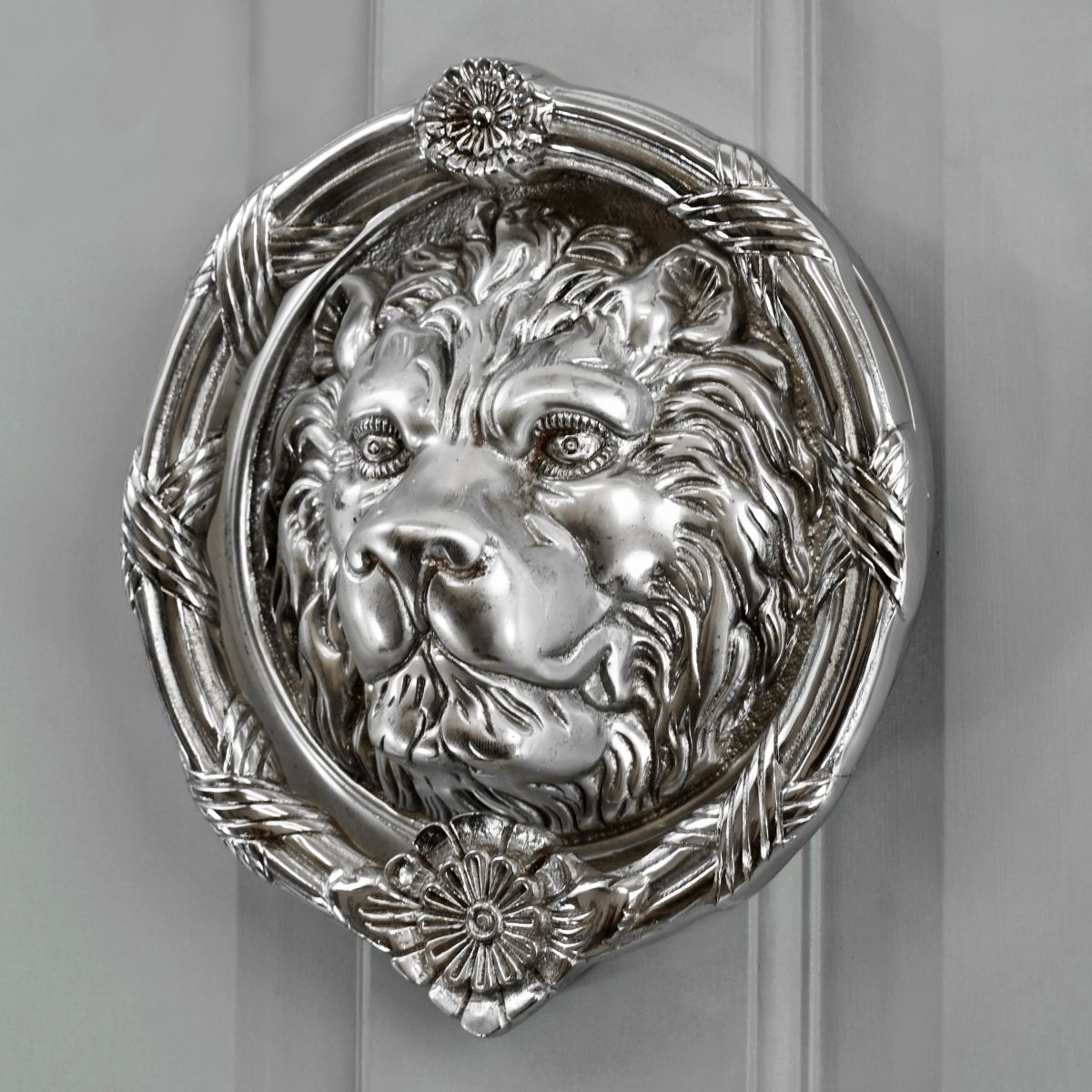 Bright Chrome Sandringham door knocker on grey door Bright Chrome Sandringham door knocker on grey door