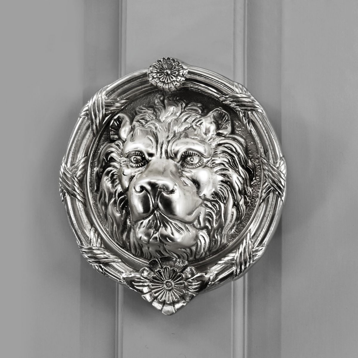 Bright Chrome Sandringham door knocker on grey door Bright Chrome Sandringham door knocker on grey door