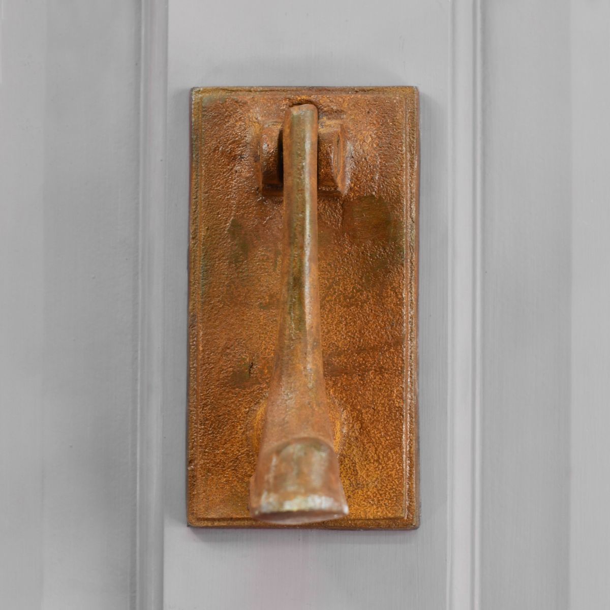 Rustic welly door knocker on front door