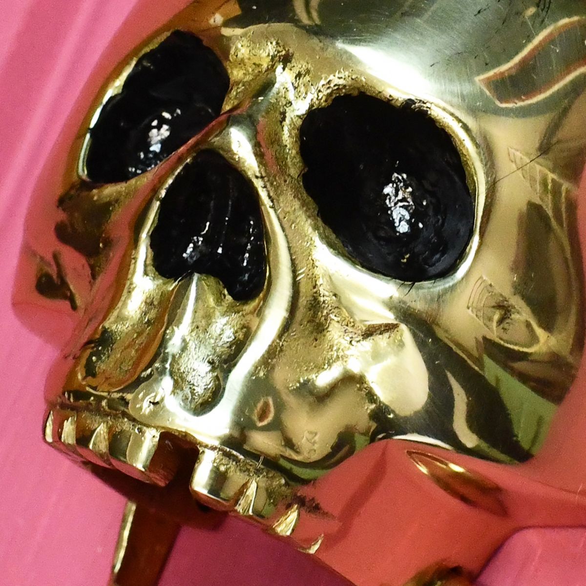 Close up of Polished Brass Skeleton Door knocker