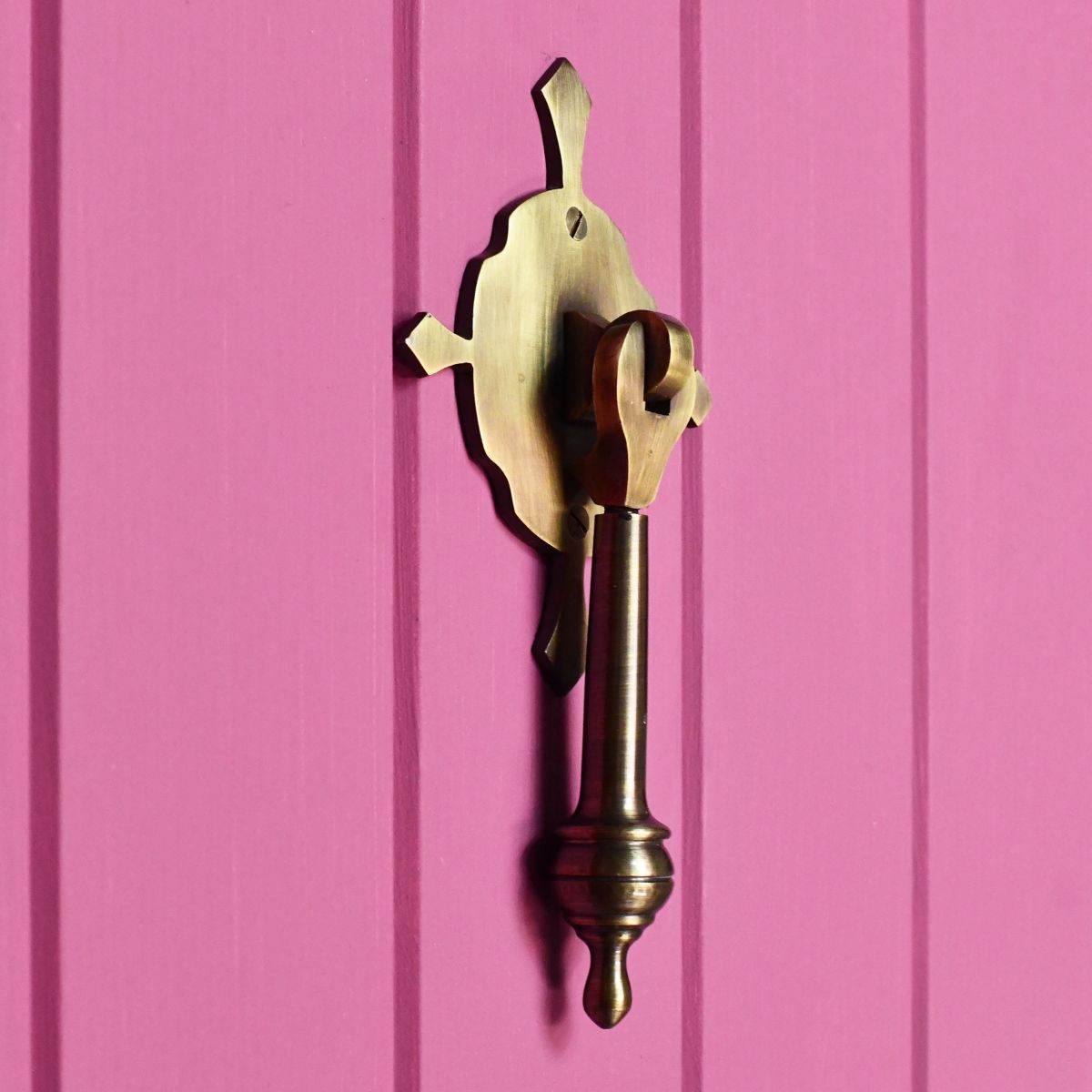Pendulum contemporary door knocker