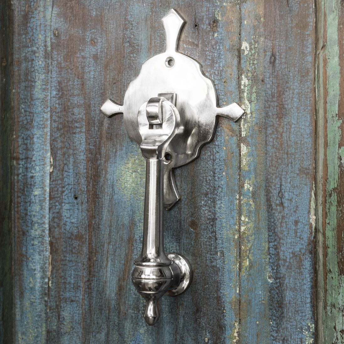 Bright Chrome door Knocker on Blue rustic door