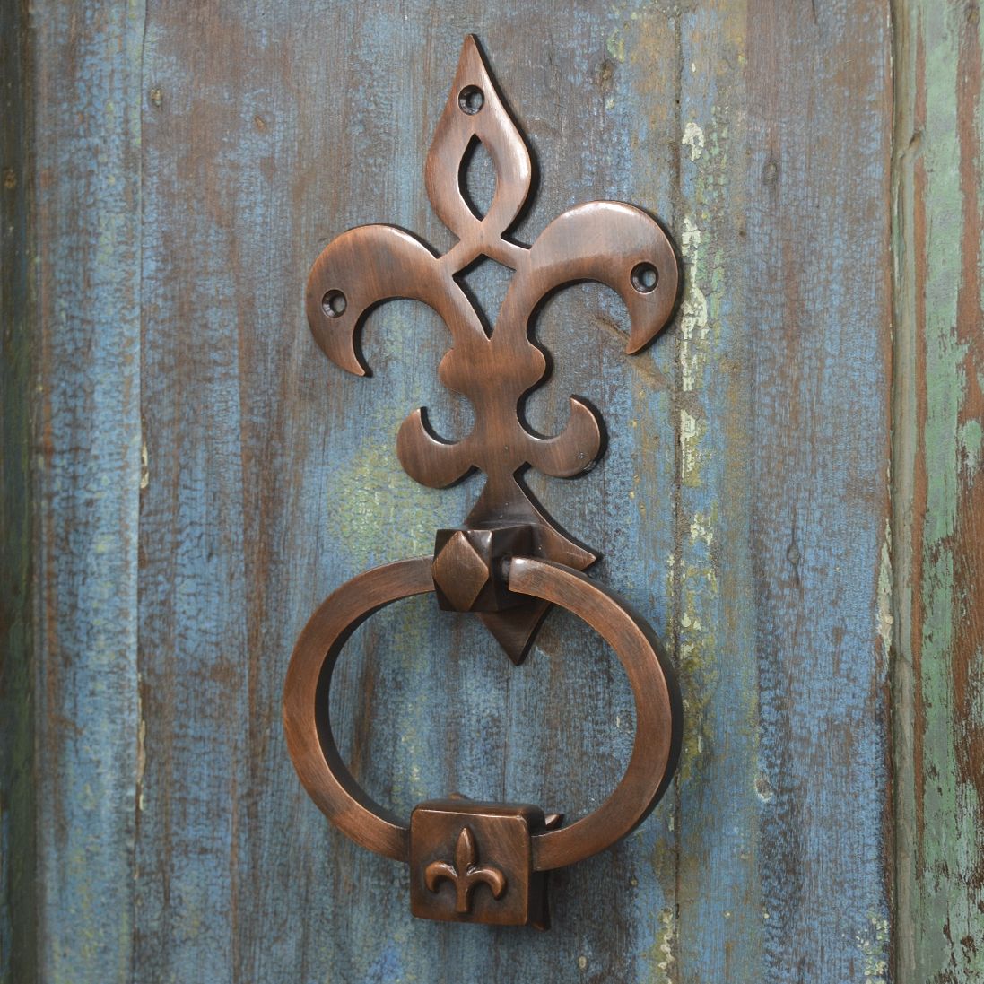 Antique Copper Door Knocker on old wooden door