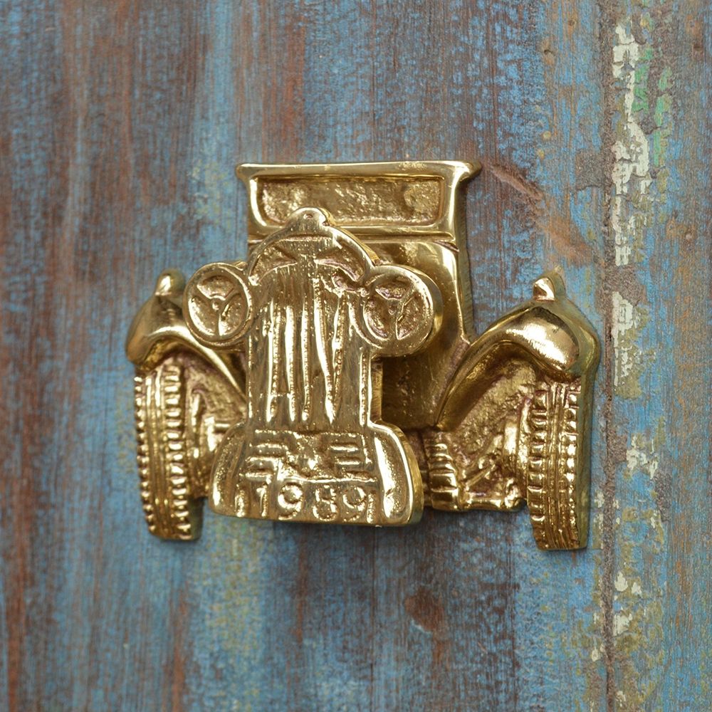 Polished Brass Car Door Knocker on Rustic Door