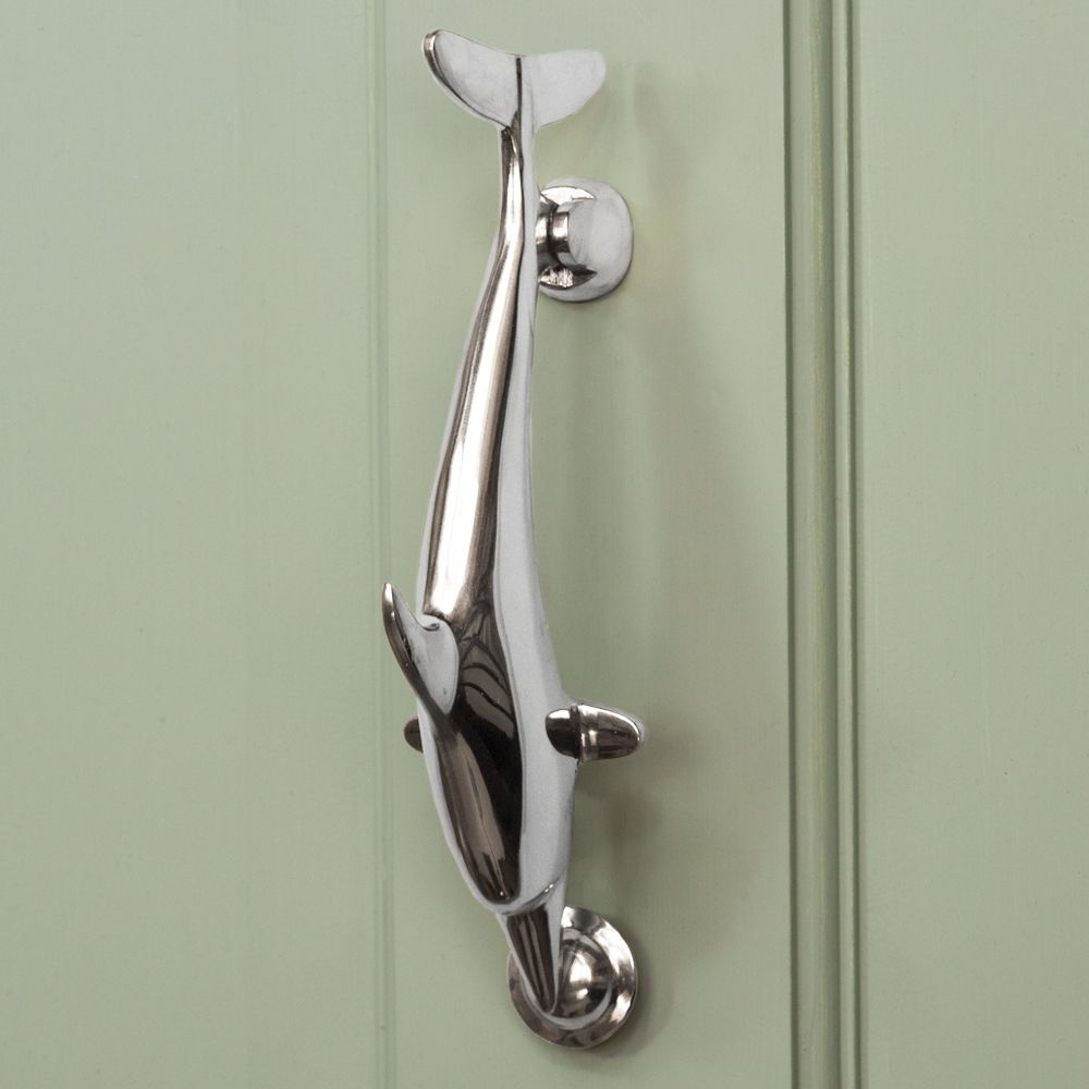 Bright Chrome Dolphin Door Knocker on pale green door