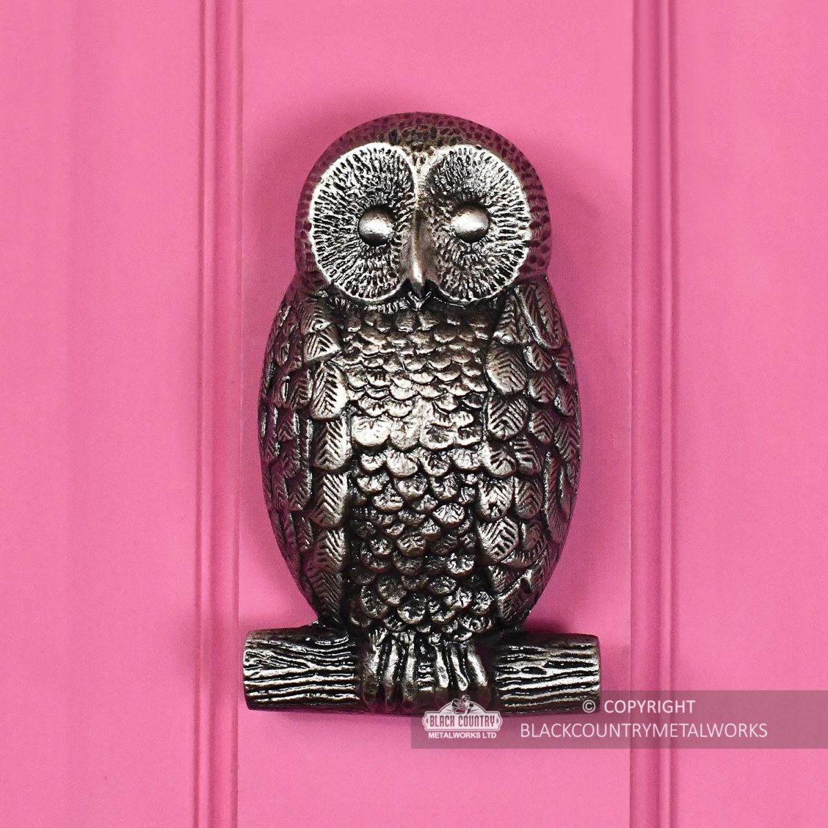 Antique Pewter Owl Door Knocker on a Pink Door
