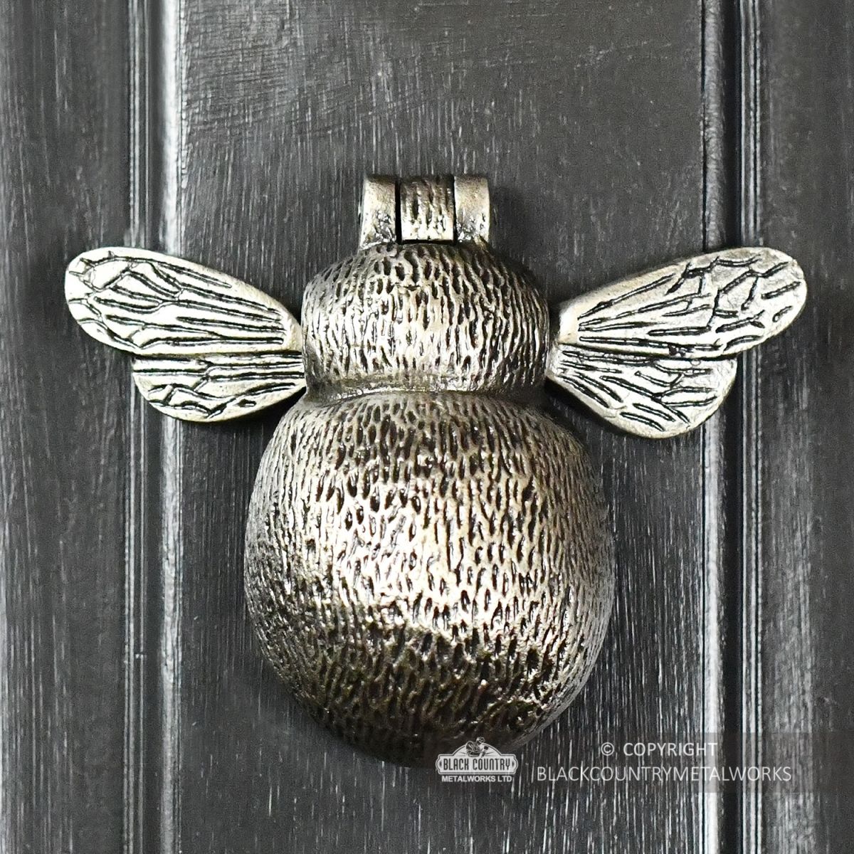 Antique Pewter Bumblebee Door Knocker on a Dark Grey Door
