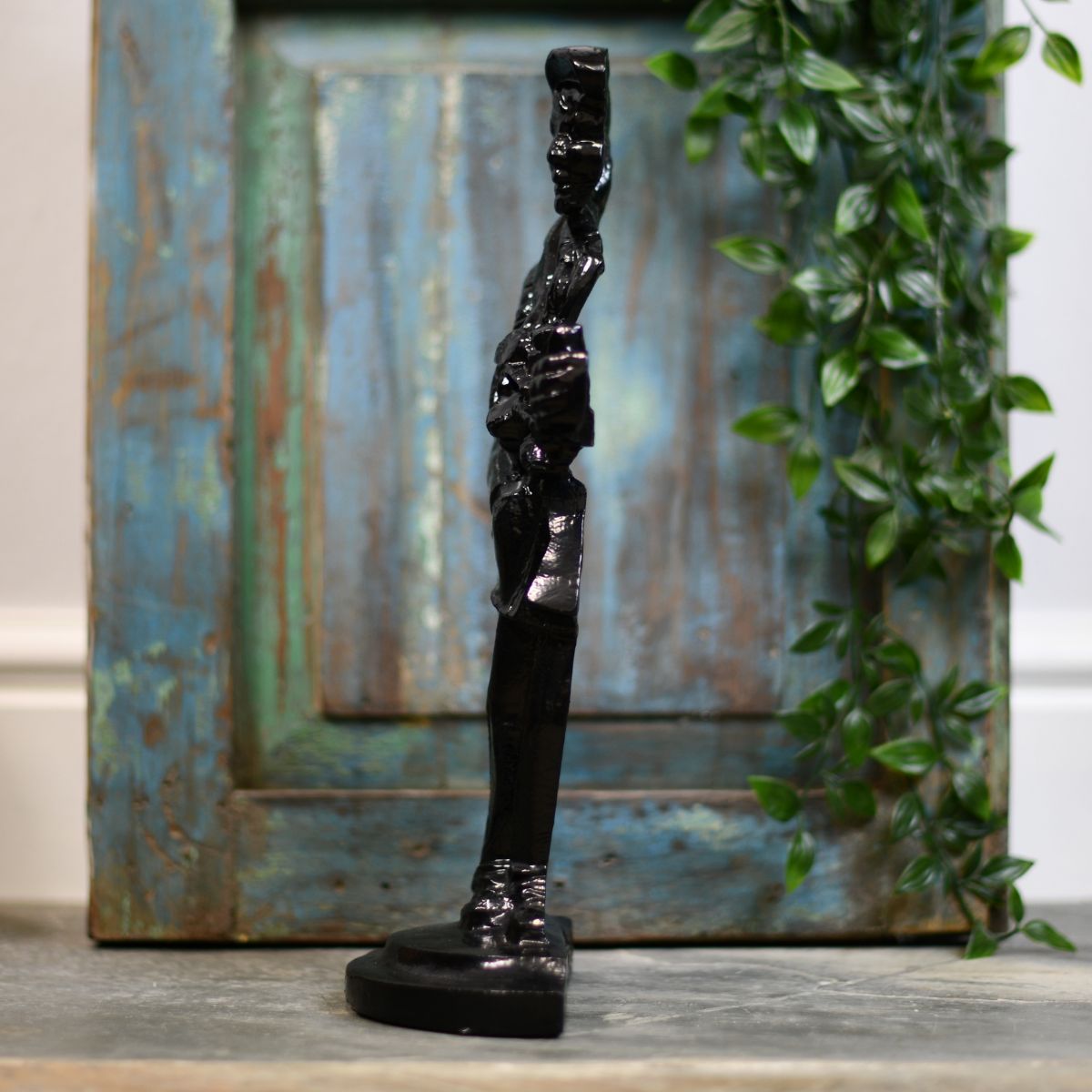 Cast iron gold door stop side view Cast iron gold door stop side view