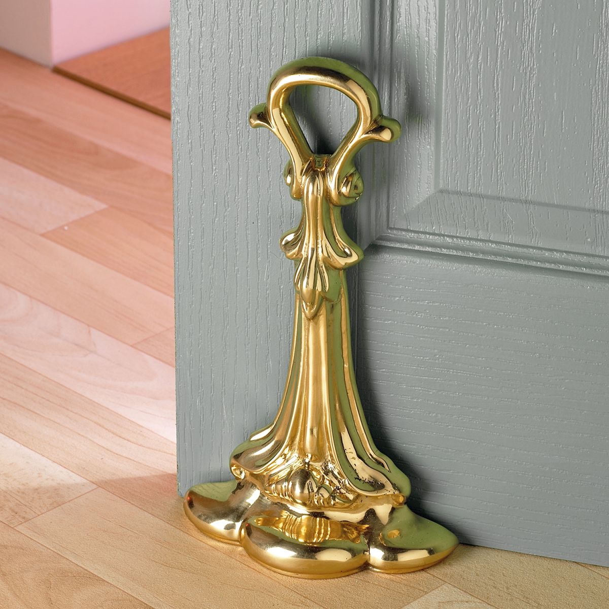 Traditional Polished Brass Door Stop by grey door