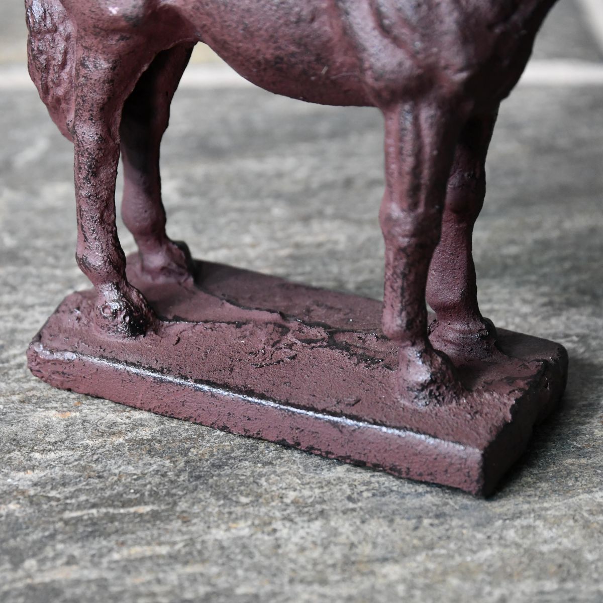 Close up of cast iron door porter stand  Close up of cast iron door porter stand