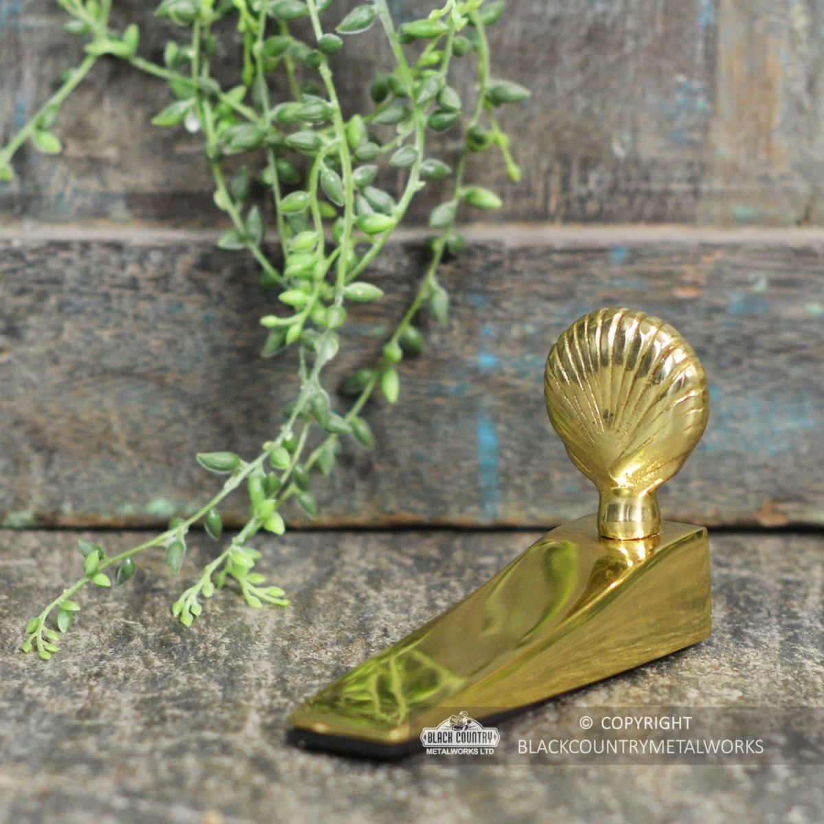 Shell Design Door Stop Finished in Polished Brass