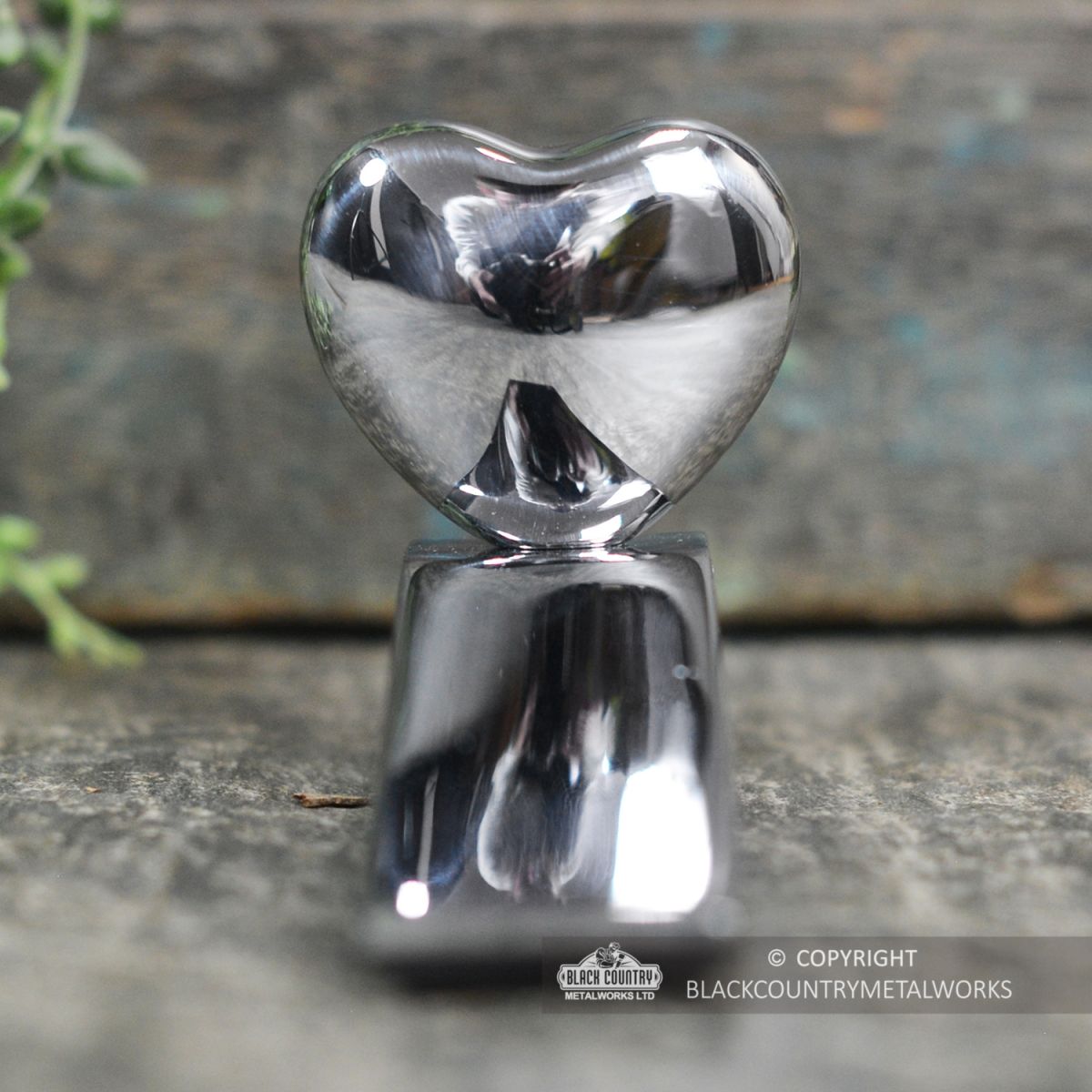 View of the Chrome Chubby Heart Door Wedge From the Front