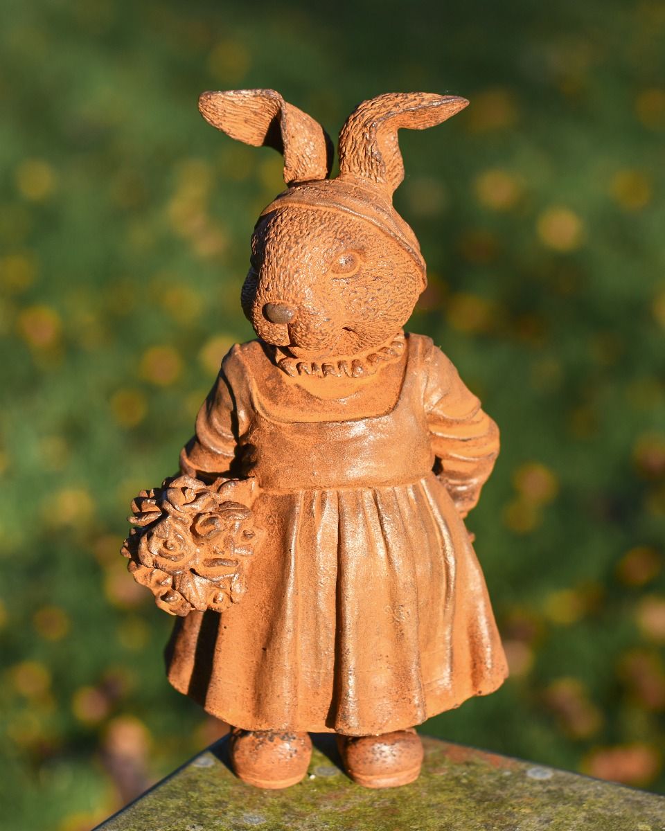Rustic Cast Iron Rabbit Holding Flowers Sculpture Rustic Cast Iron Rabbit Holding Flowers Sculpture