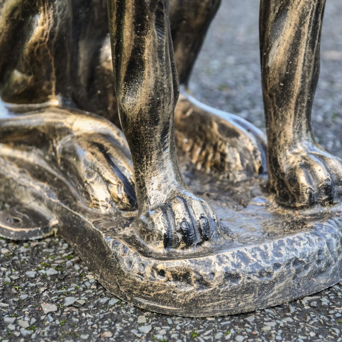 Close-Up of Feet and Sculpture Base Close-Up of Feet and Sculpture Base
