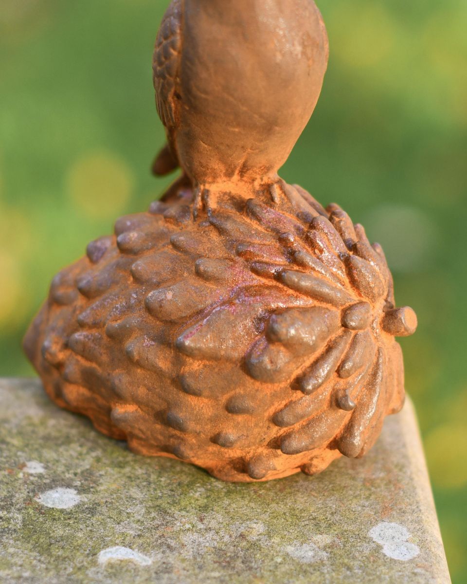 Close Up Of Rustic Pinecone On Garden Sculpture Close Up Of Rustic Pinecone On Garden Sculpture