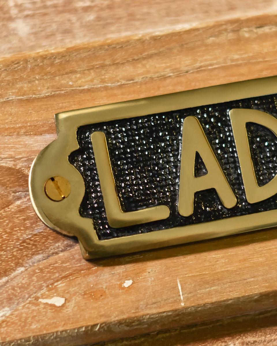 Close Up of Solid Brass Ladies Sign Close Up of Solid Brass Ladies Sign