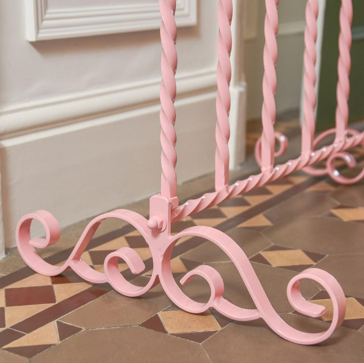 Close up of Wrought Iron Scrollwork in Pink  Close up of Wrought Iron Scrollwork in Pink