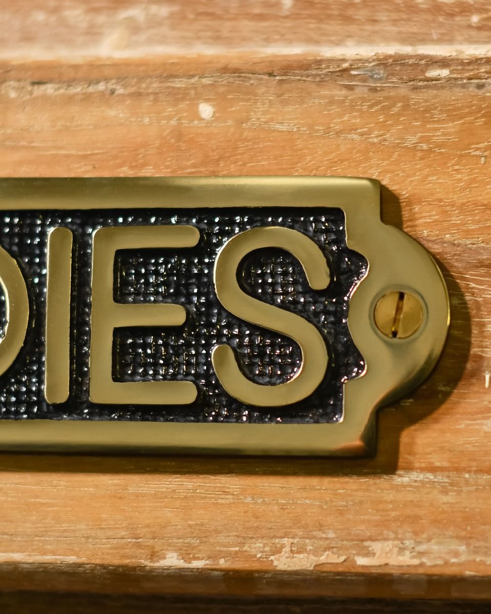 Close Up of Solid Brass Ladies Sign Close Up of Solid Brass Ladies Sign