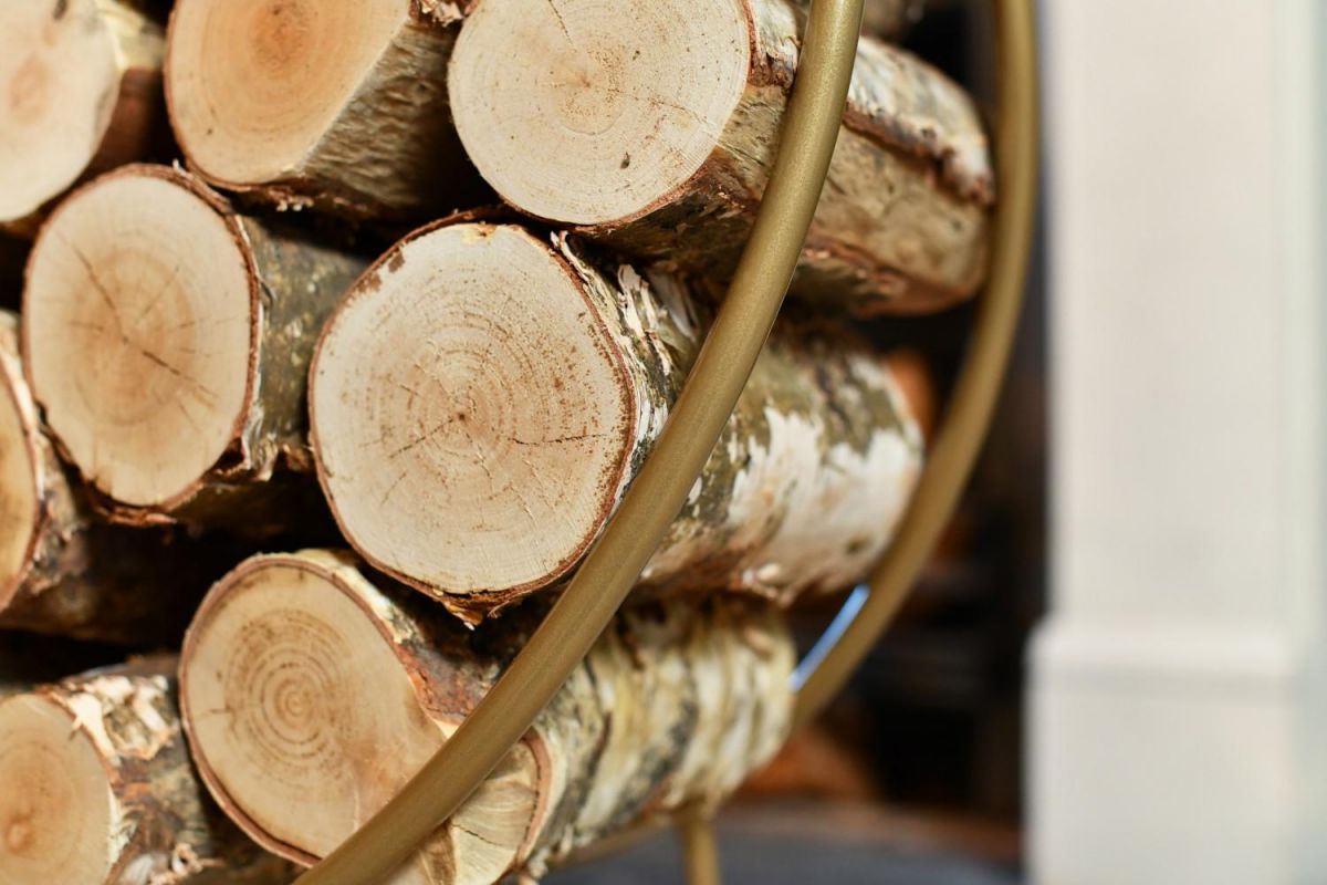 Close-up of Modern Circular Log holder in a Gold Finish Close-up of Modern Circular Log holder in a Gold Finish