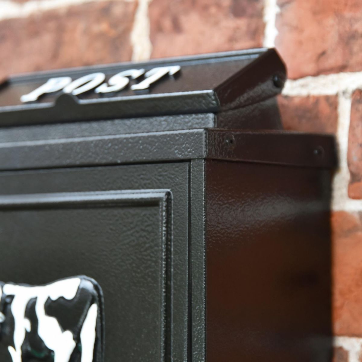 Close up of black finish on "Black & White Cow" Wall Mounted Post Box Close up of black finish on "Black & White Cow" Wall Mounted Post Box