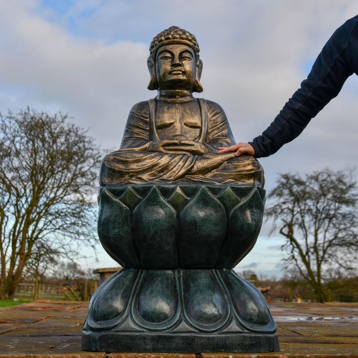 Antique Gold Buddha Sculpture with hand for scale  Antique Gold Buddha Sculpture with hand for scale