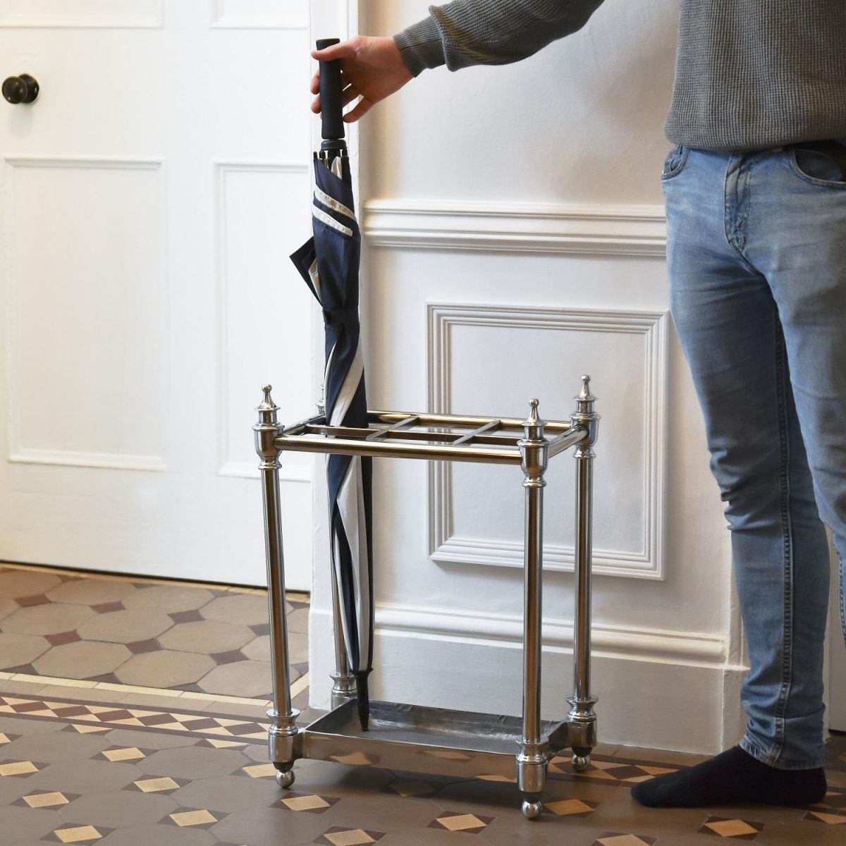 Antique Nickel "Rectangle" Umbrella Holder with Male for Scale  Antique Nickel "Rectangle" Umbrella Holder with Male for Scale