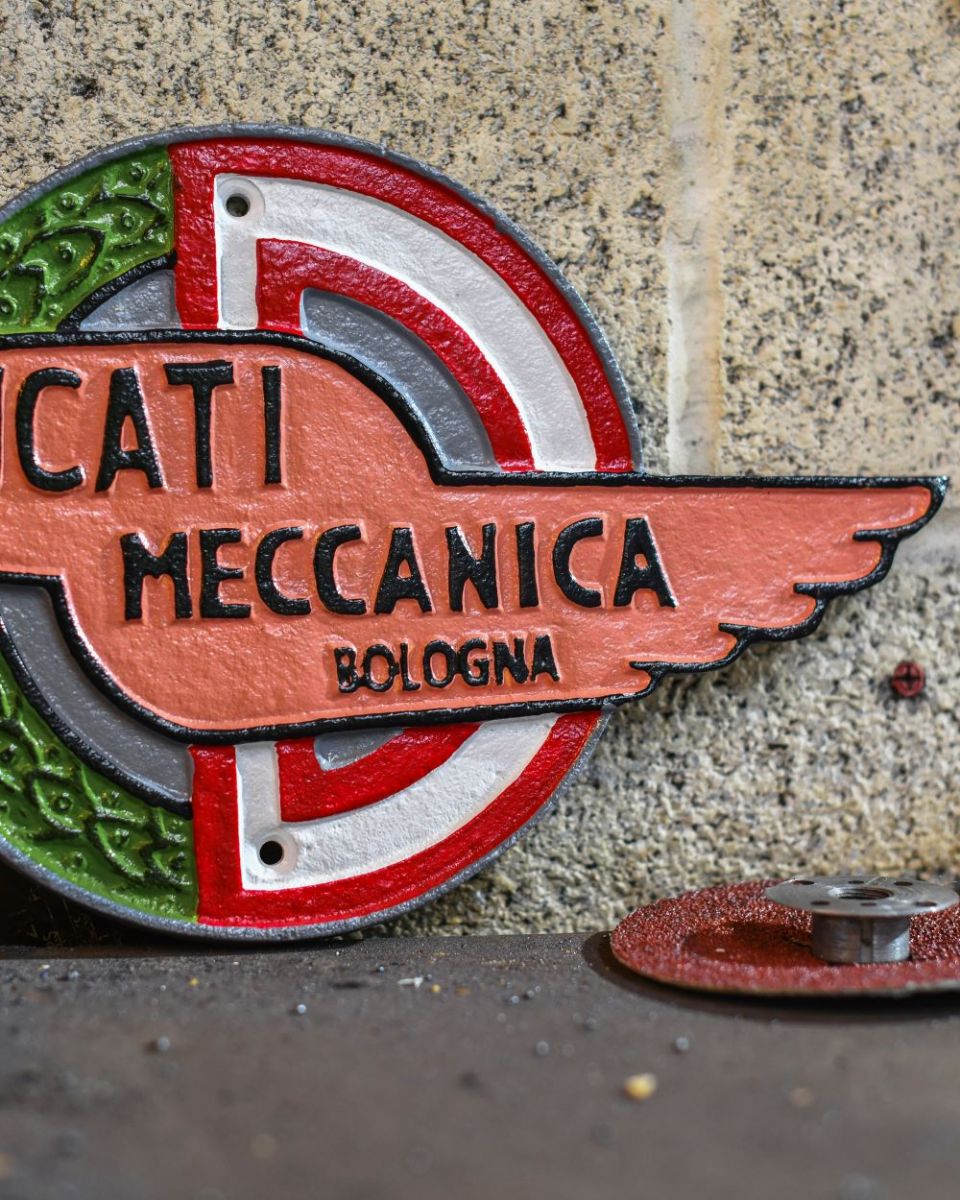 Close up of Ducati Vintage Style Cast Iron Sign finish Close up of Ducati Vintage Style Cast Iron Sign finish