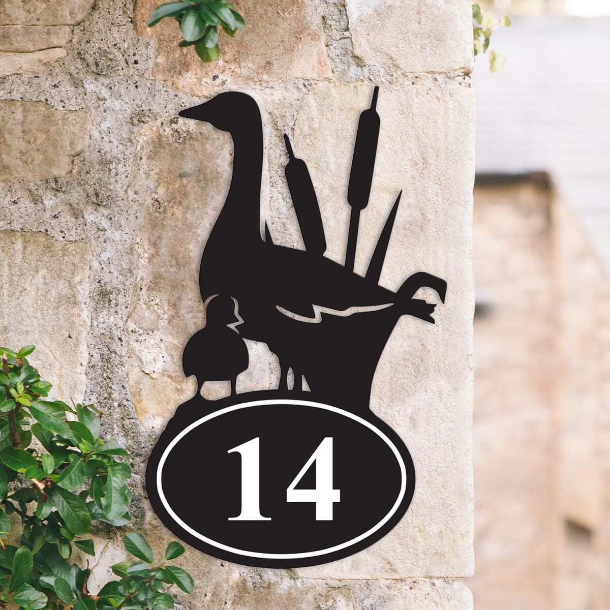 Bespoke Duck Iron House Number Sign on a Garden Wall