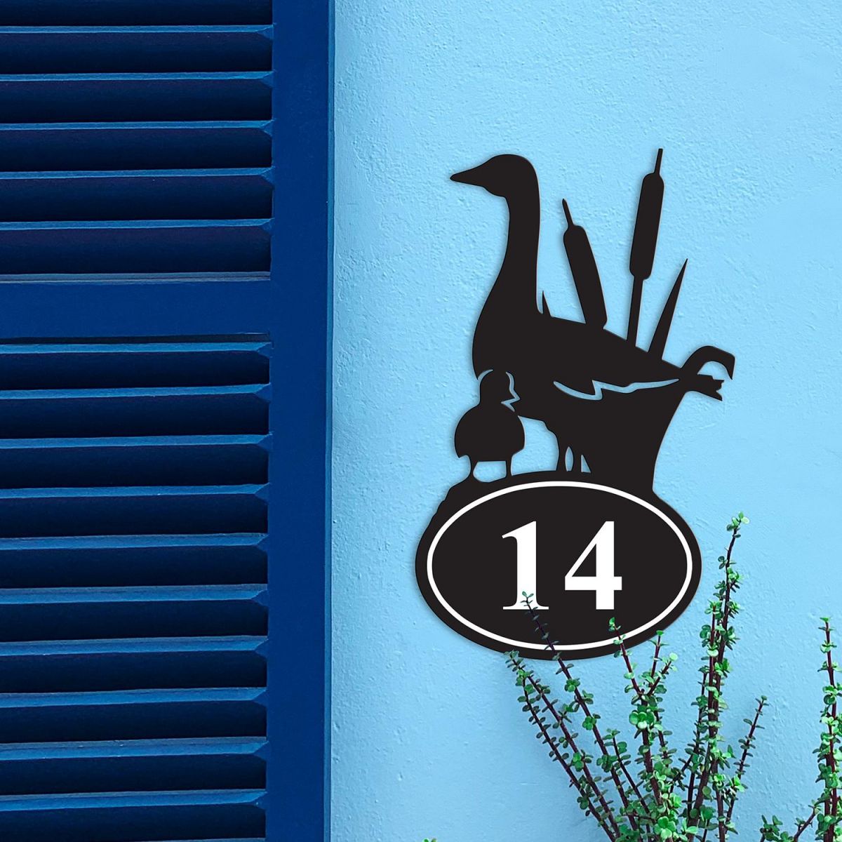 Duck Iron House Number Sign in Situ on a Blue Wall 