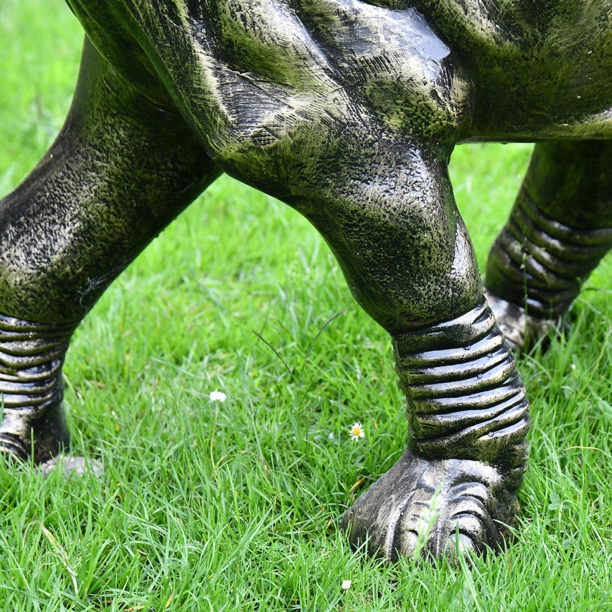 Close-up of the Feet on the Elephant Calf Water Fountain